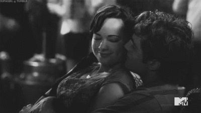 Loving Couple Cuddling And Cheek Kiss GIF