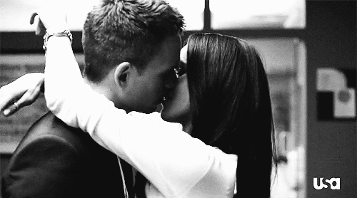 Arms around his neck kiss gif