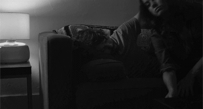 Couple cuddles on couch gif