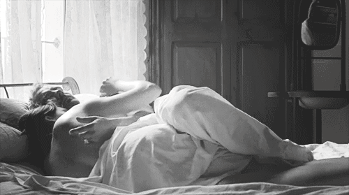 Couple cuddling after sharing intimate moment gif