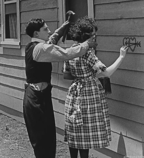 Couple Makes Heart Symbol GIF