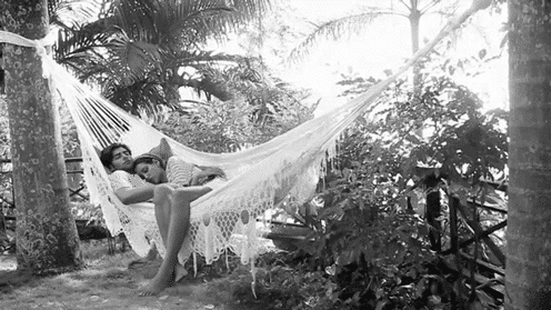 Cute couple cuddling on a hammock