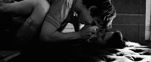 Cute couple cuddling on bed gif
