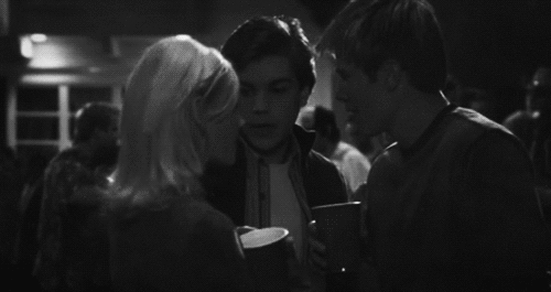 Flirty Group Laughter At Party GIF
