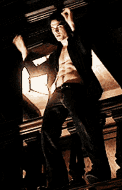 Flirty Shirtless Man Dances On Balcony GIF