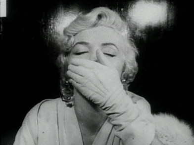 Flirty Woman Covers Mouth GIF