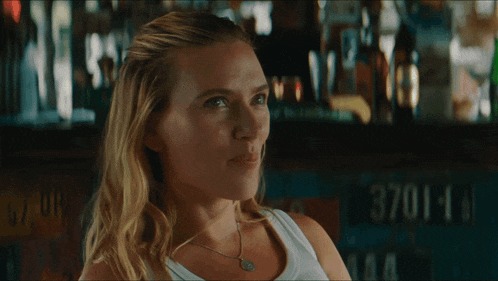 Flirty Smoldering Glance At Bar GIF