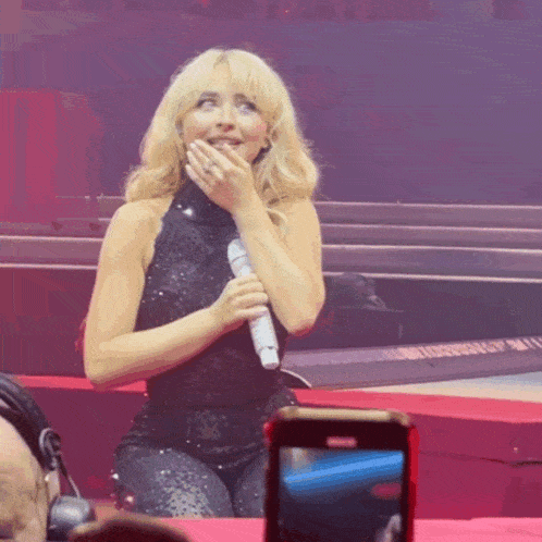 Flirty Surprise Smile On Stage GIF
