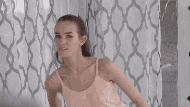 Flirty Woman Glances Over Shoulder GIF