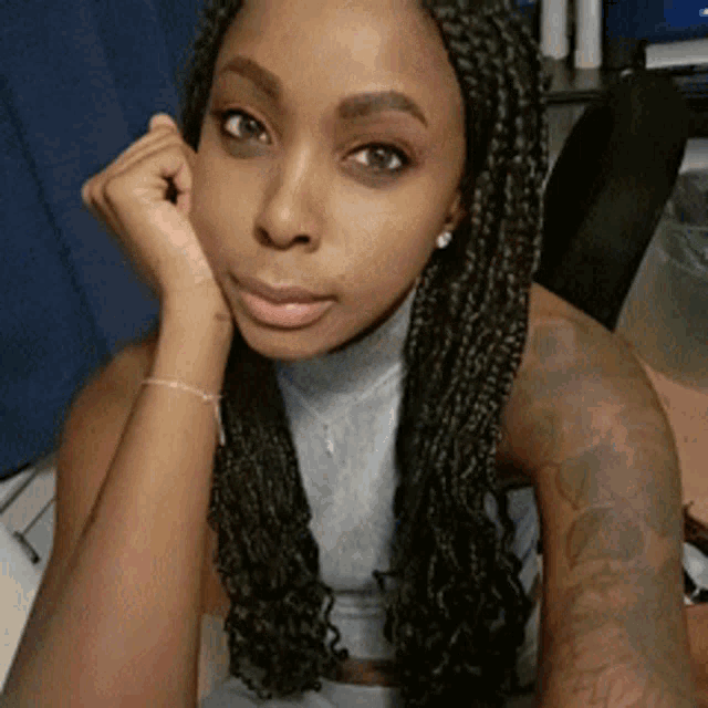 Flirty Woman Resting Chin On Hand GIF