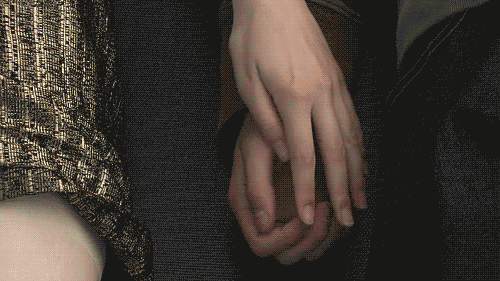 Intertwined Hands Showing Loving Affection GIF