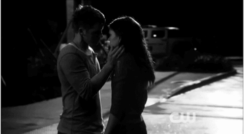 Intimate Nighttime Forehead Kiss GIF