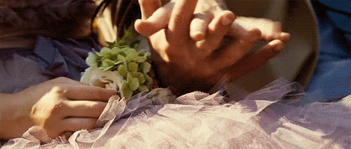 Loving Hands Holding Green Flower GIF