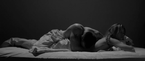 Man cuddles on top of woman gif