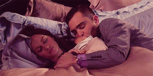 Man cuddles woman while she sleeps gif