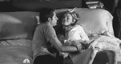 Man pulls woman closer to cuddle gif