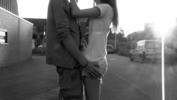 Passionate Couple Embrace and Gaze GIF