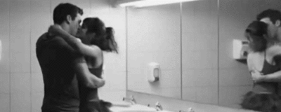 Passionate Couple Kissing In Bathroom GIF