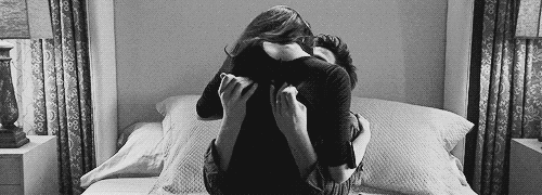 Passionate Couple Kissing On Bed GIF