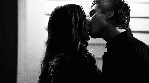 Passionate Kiss in Dark Mood GIF
