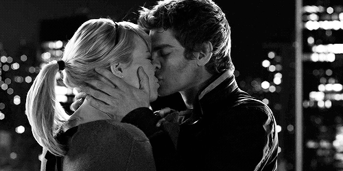 Passionate Kiss Under City Lights GIF