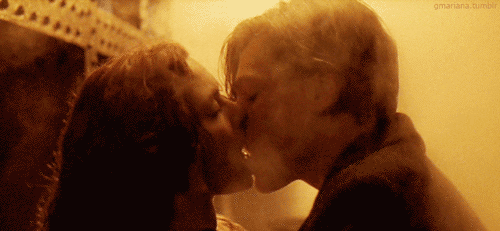Passionate Kiss in Golden Glow GIF