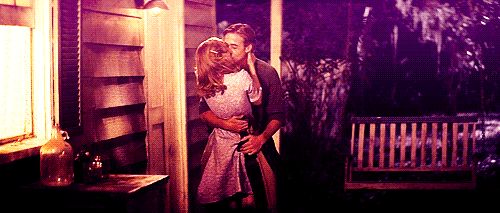 Passionate Kiss Under Porch Light GIF