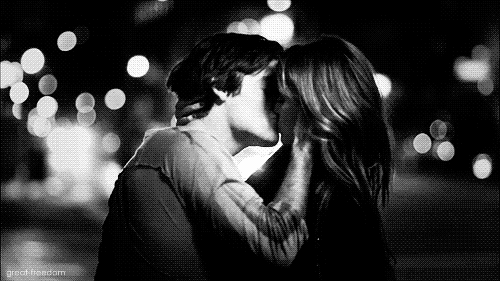 Passionate Kiss In Urban Bokeh GIF