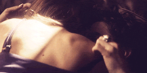 Passionate Lovers Embrace In Dim Light GIF