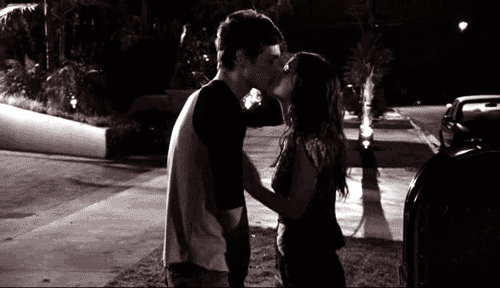 Passionate Night Kiss Under Glow GIF