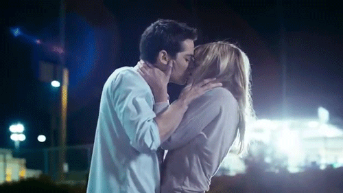 Passionate Night Kiss Under Lights GIF