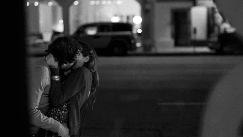 Passionate Night Kiss Under Streetlights GIF