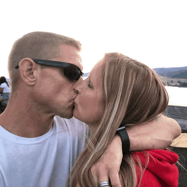 Passionate Sunset Kiss GIF