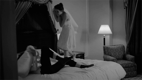 Playful Bride Teases Husband In Bed GIF