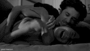 Playful Couple Cuddling And Kissing GIF