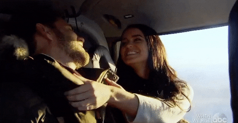 Playful Couple Cuddling Intimately GIF