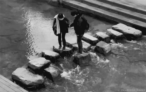 Playful Stepping Stones Kiss GIF