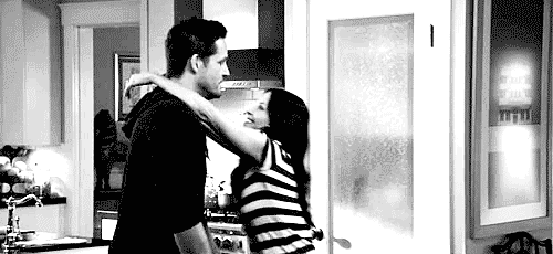 Playful Hug And Kiss In Kitchen GIF