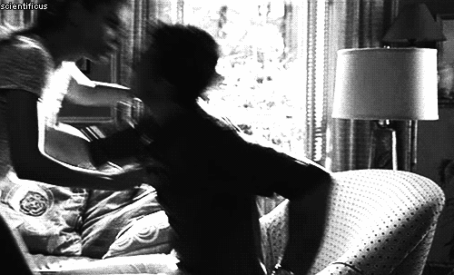 Playful Flirtatious Couch Kiss GIF