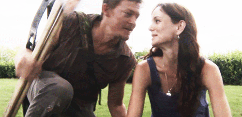 Flirty Intimate Gaze With Garden Tool GIF