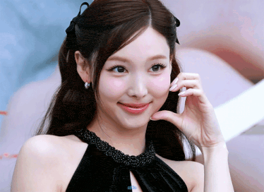 Playful Flirty Woman Touches Her Cheek GIF