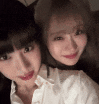 Playful Friends Share Affectionate Kiss GIF