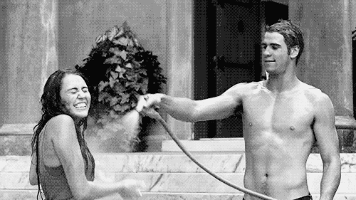 Playful Hose Spray Flirty Kiss GIF
