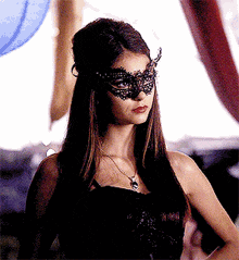 Playful Masquerade Flirt GIF