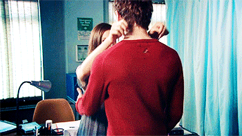 Playful Shirt Pull Intimate Moment GIF