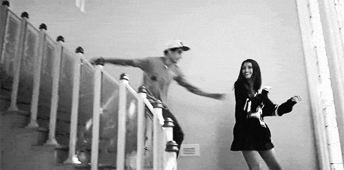Playful Staircase Chase Flirty GIF