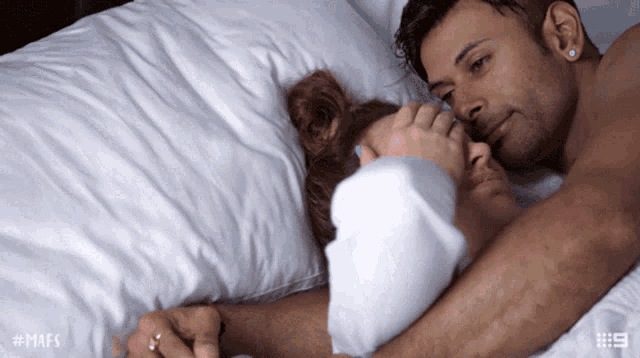 Romantic Couple Cuddling In Bed GIF
