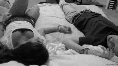 Romantic Couple Cuddling On Bed GIF
