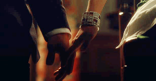 Romantic Couple Holding Hands GIF