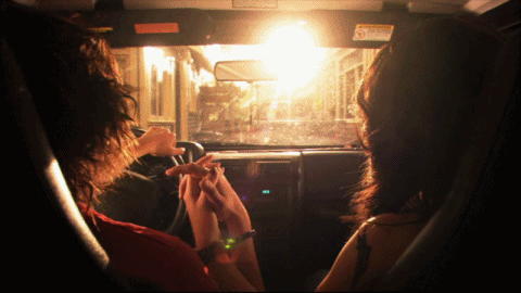 Romantic Couple Holding Hands In Car GIF